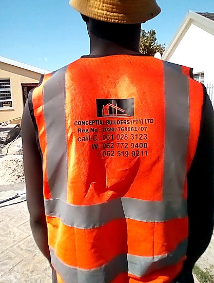 Conceptial Builders team member in branded, registered company uniform